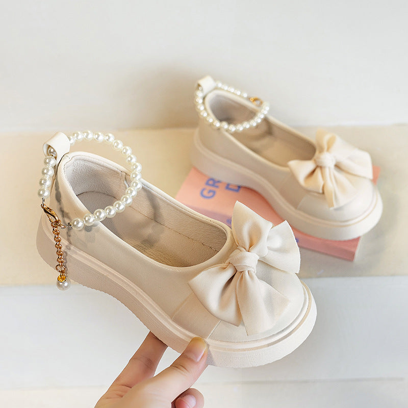 White kids athletic shoes with lightweight and breathable design for active wear