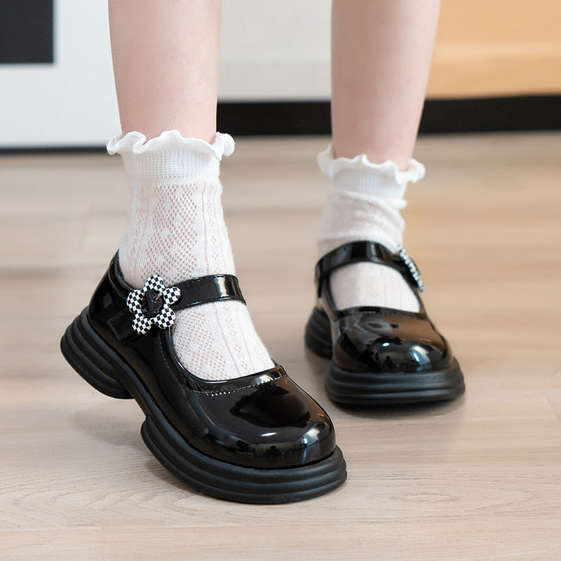 Black kids athletic shoes with lightweight and breathable design for active wear