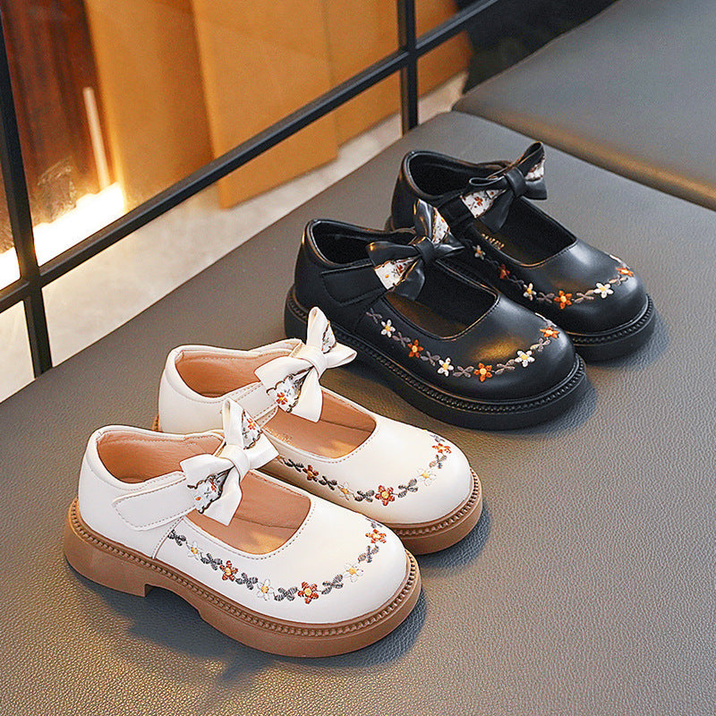 Black kids athletic shoes with lightweight and breathable design for active wear