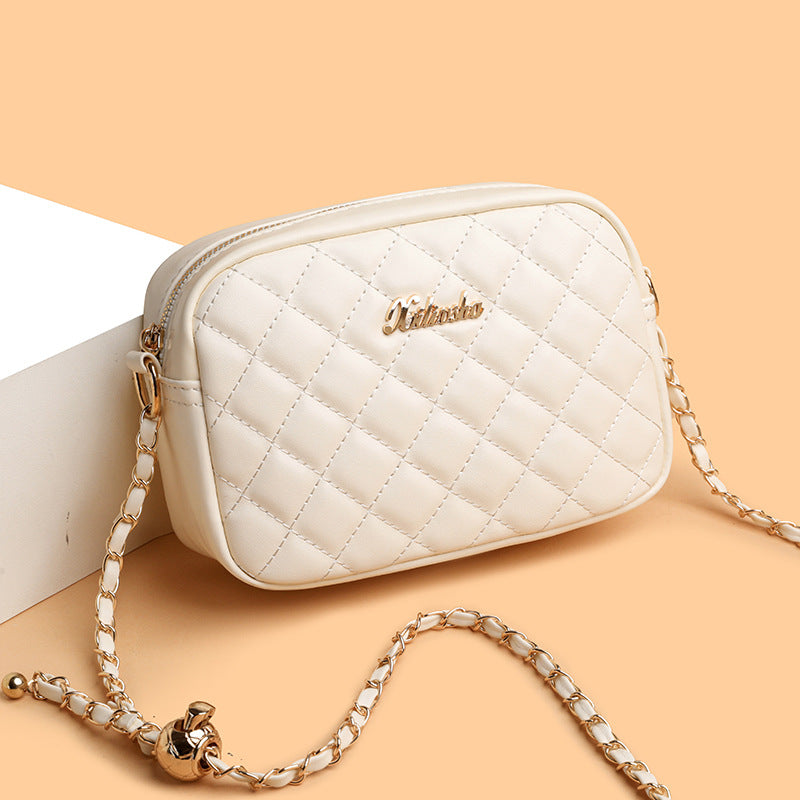 Black quilted three-zipper crossbody camera bag for women