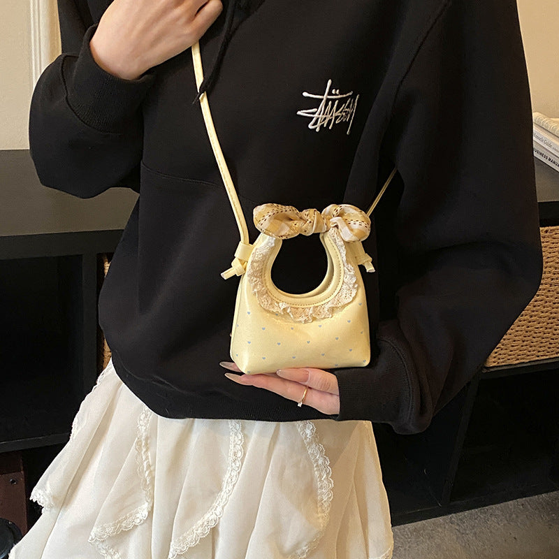 Yellow girls crossbody bag with compact design for everyday casual use