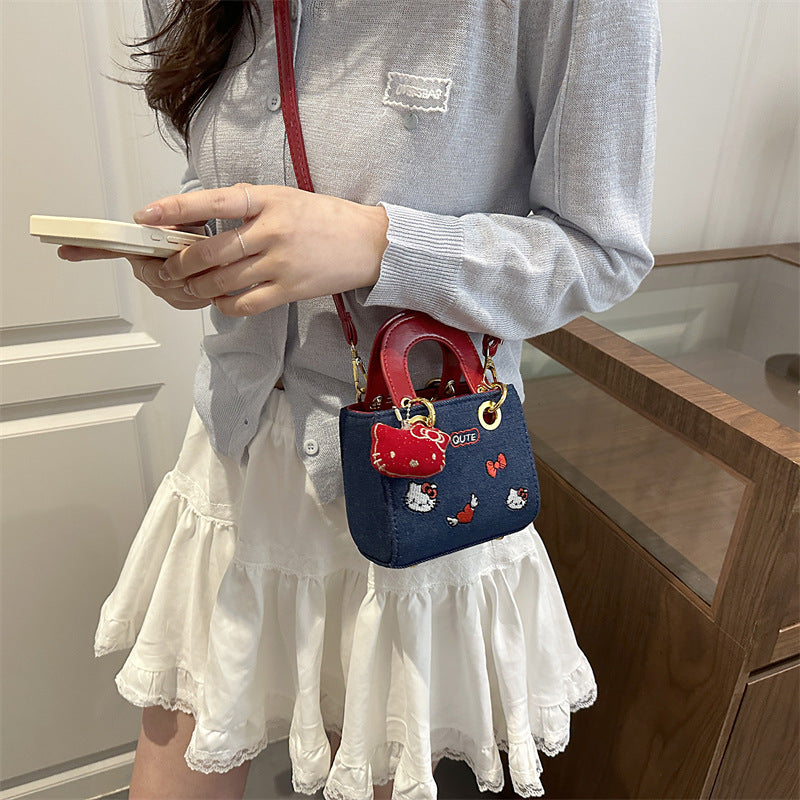Red girls crossbody bag with compact design for everyday casual use