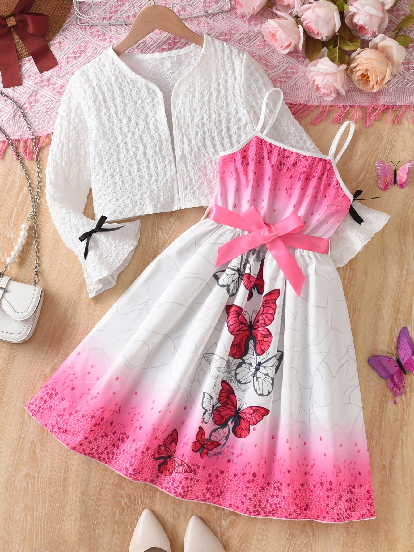 Girls pink back bow princess mid-length summer dress with flowing silhouette