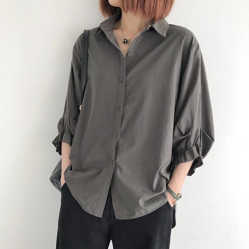 White sculptural lantern-sleeve blouse in breathable summer crepe
