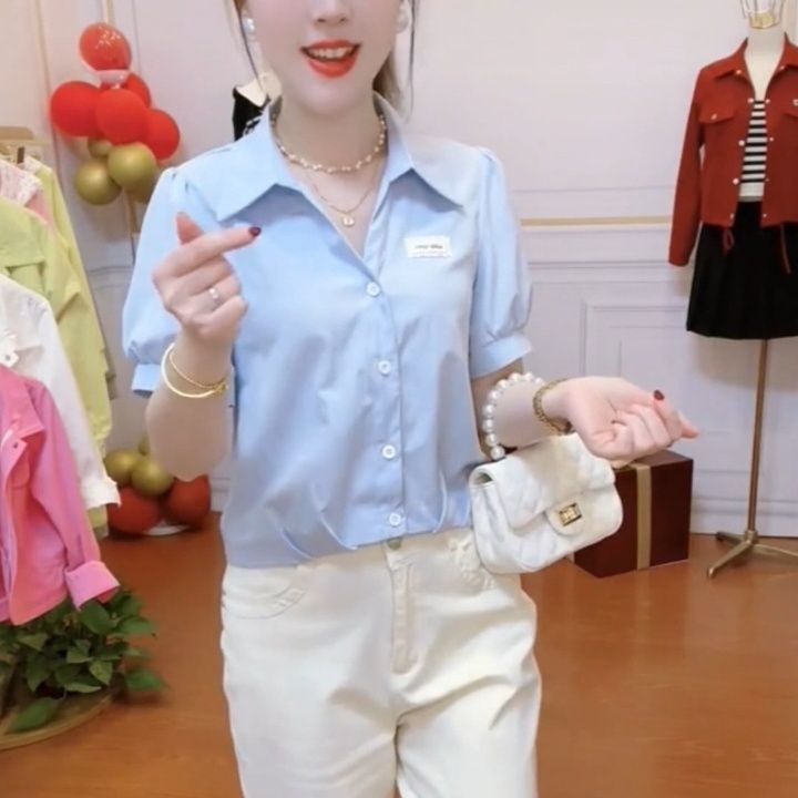 White sculptural short-sleeve chiffon blouse in "age-reducing" niche design
