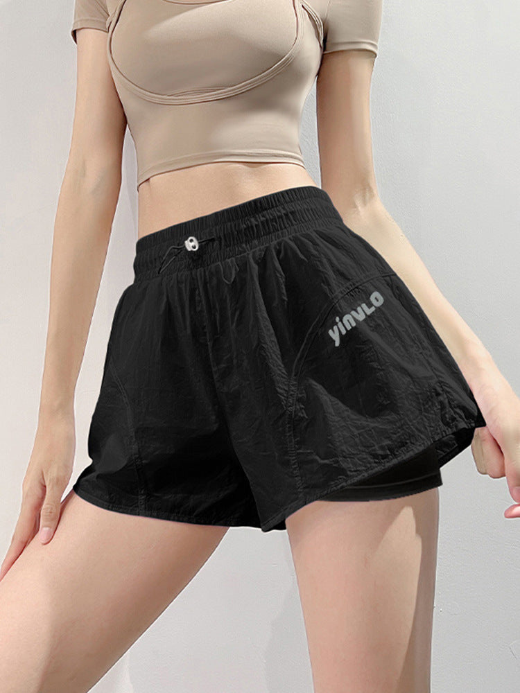 Black quick-dry mid-length performance shorts for women