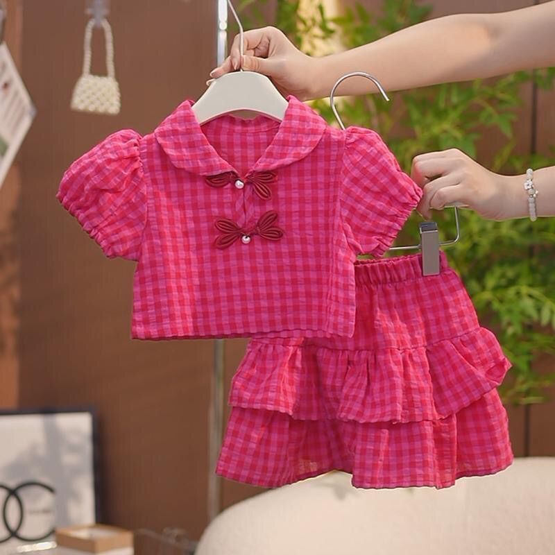 Girls red plaid two-piece set with pearl button detail for summer casual wear