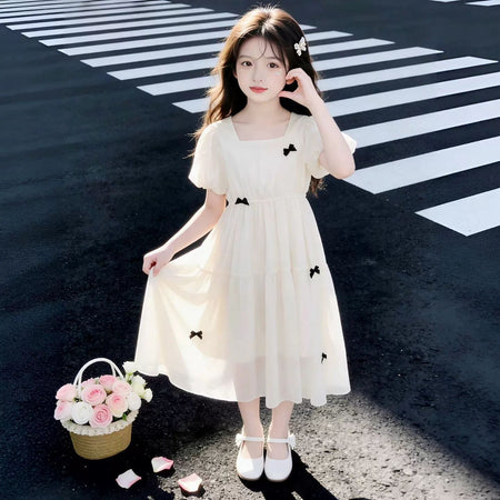 Girls princess A-line summer dress in beige with bow detail for everyday wear