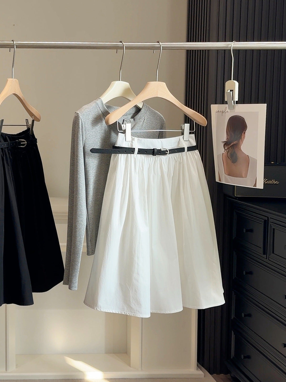 White high-waisted white academy-style a-line midi skirt